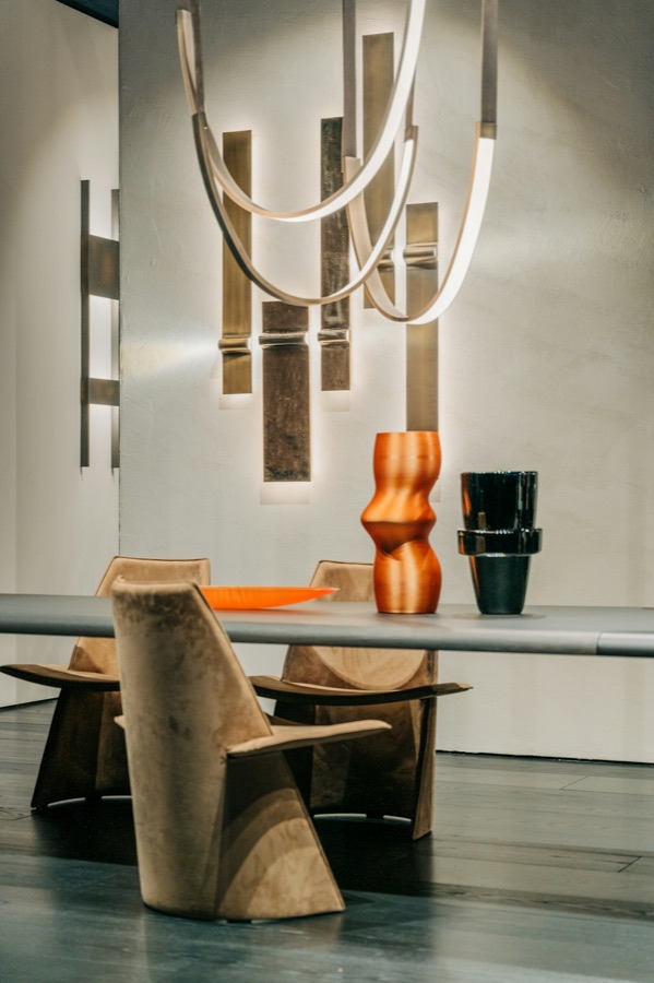 Sculptural dining chair under a pendant light