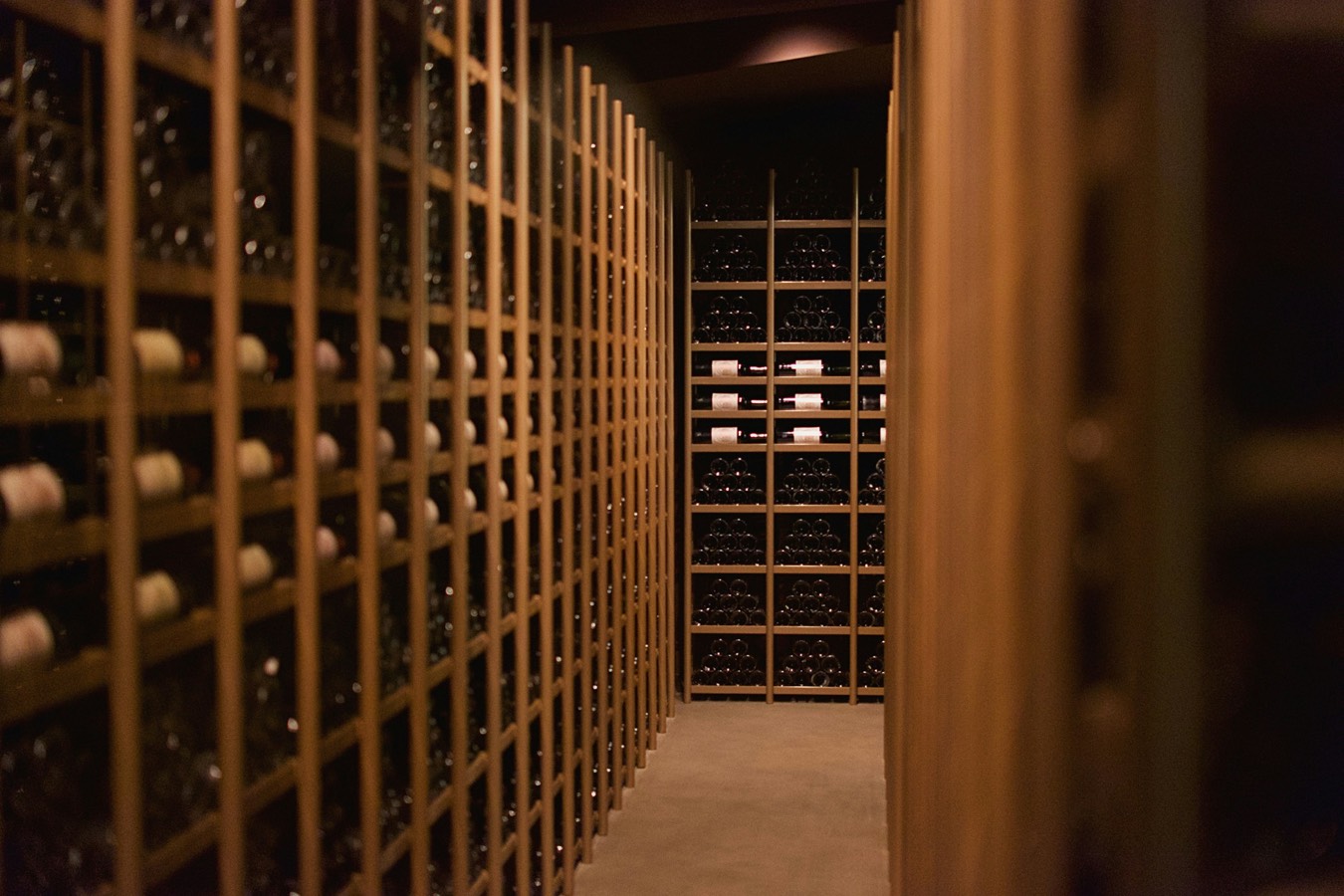 Private wine room lined with oak racks