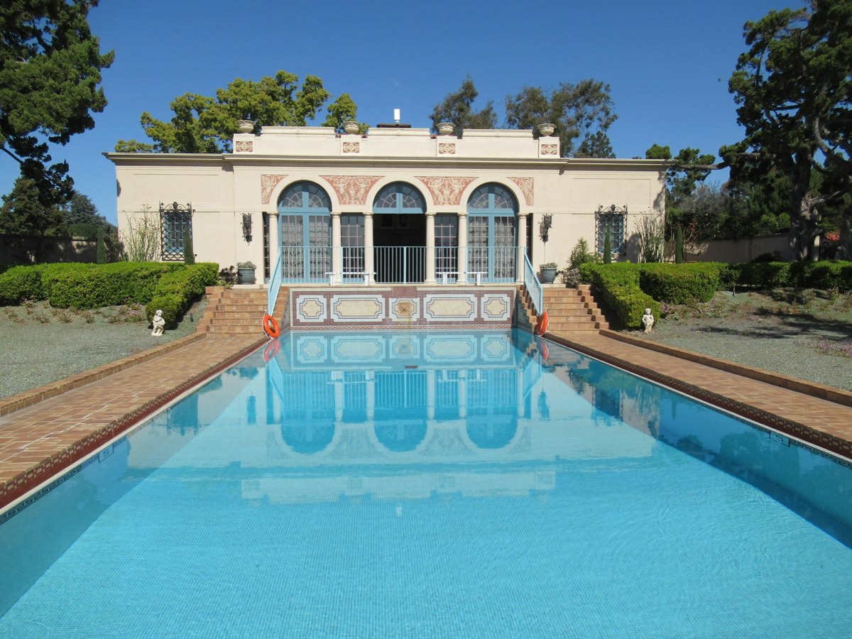 Mediterranean villa behind a long reflecting pool