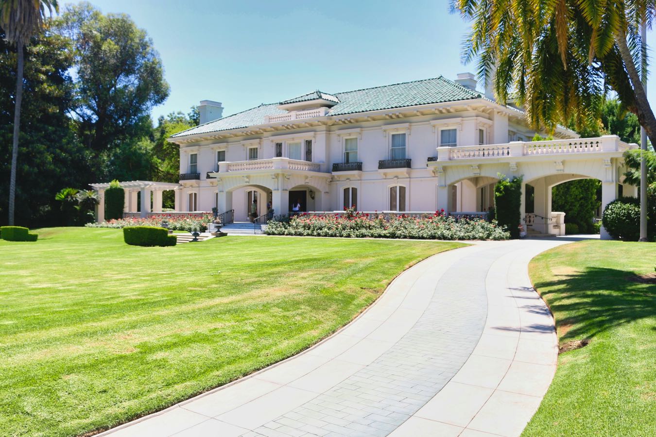 Estate at the end of a long lawn and curved drive